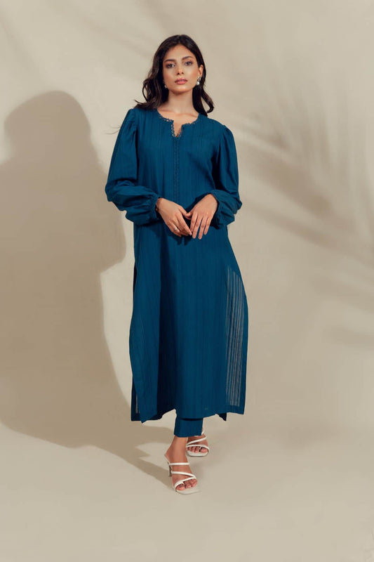 Model wearing Embroidered midnight blue pleated shirt with lace finishing